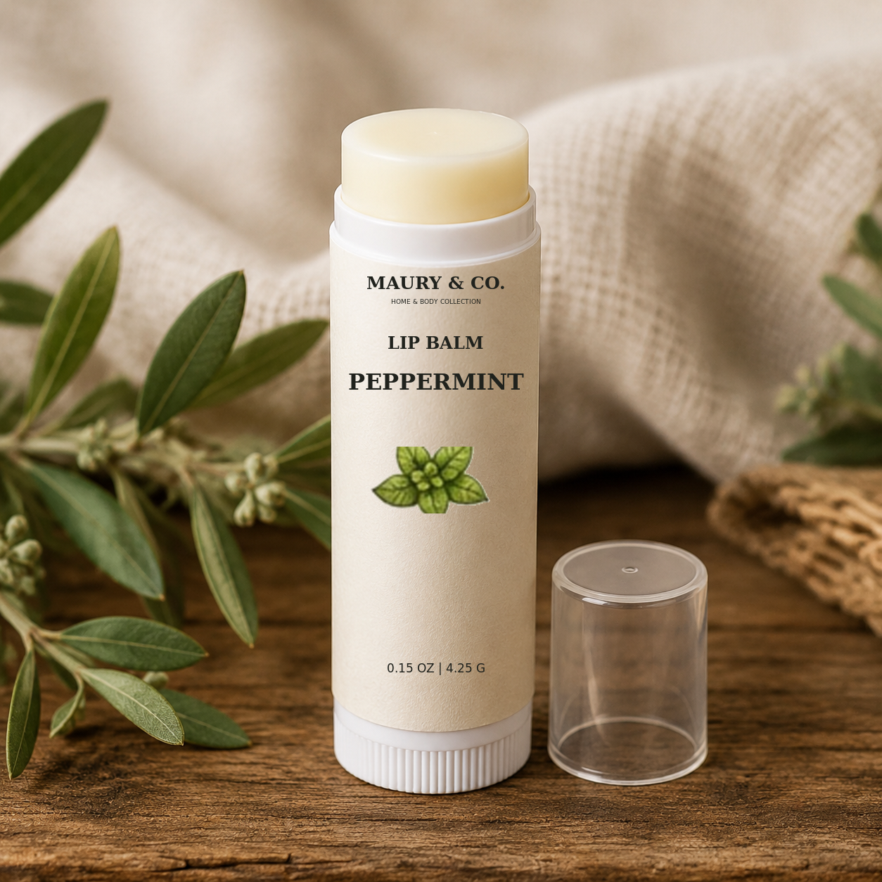 Peppermint Lip Balm, fully shown with its matching label in a lifestyle scene